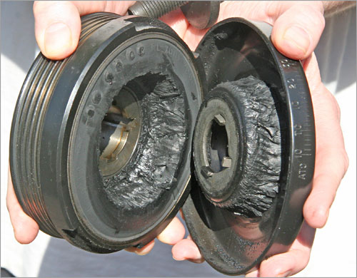 The rubber donut inside the Ford’s harmonic balancer was ripped in two