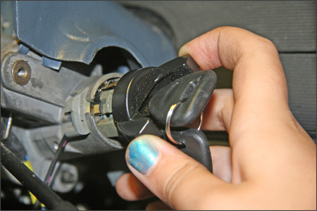my ten-year-old daughter inserting a new Standard Motor Products ignition lock cylinder in our Tempo